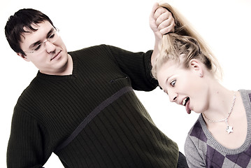 Image showing man pulling hair of the girl   