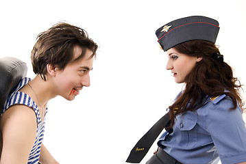 Image showing Young woman in police uniform and a criminal