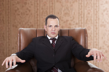 Image showing Businessman upset seated on a chair,