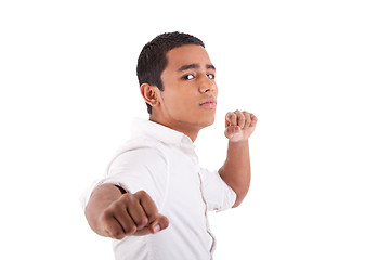 Image showing Portrait of a very happy  young latin man with his arms raised