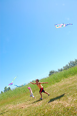 Image showing kids flying kites high up