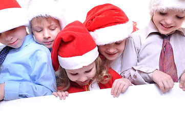 Image showing Christmas children with a banner