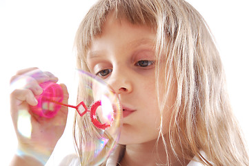 Image showing child blowing bubbles