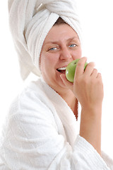 Image showing matured adult smile woman with an apple