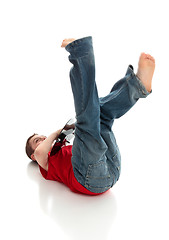 Image showing Fun little boy playing a guitar