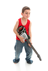 Image showing Little musician playing a guitar