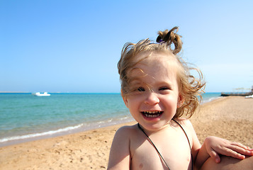 Image showing laughing little girl on beach