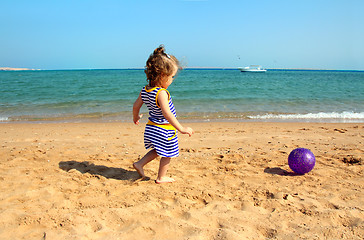 Image showing girl playing with ball on beach