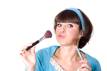 Image showing brunet woman with two make-up brushes