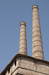 Image showing Old Abandoned factory chimneis