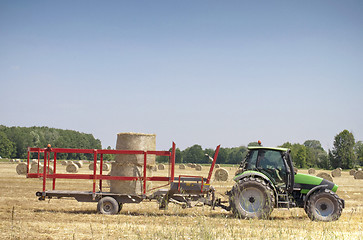 Image showing Tractor on hay balls