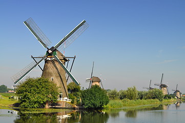 Image showing Dutch mills over a river