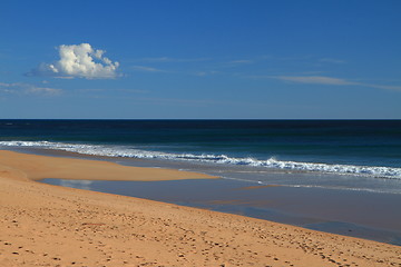 Image showing Tranquil beach and a cloud