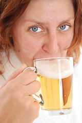 Image showing mature adult woman drinking beer