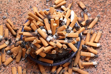 Image showing ashtray full of cigarettes close-up