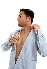 Image showing Man spraying perfume cologne