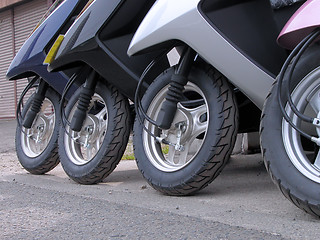 Image showing Scooter wheels in a row