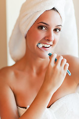 Image showing Woman brushing teeth