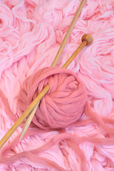 Image showing Sphere of pink wool with needles