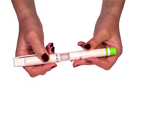 Image showing Opening an insulin pen