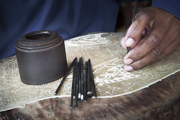 Image showing Traditional craftsman carving wood