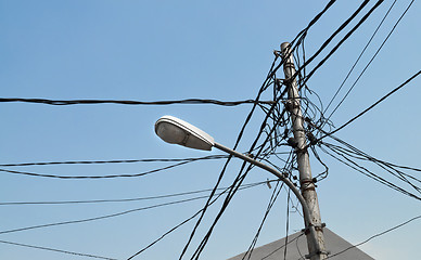 Image showing Streetlight pole with cables