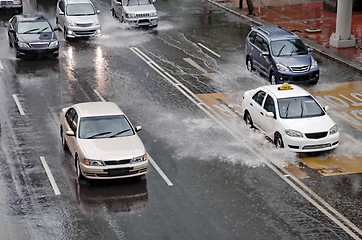 Image showing Car Driving On Flooded Street