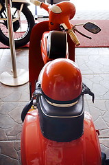 Image showing  Italian old moped Vespa with helmet