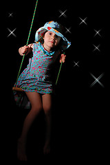 Image showing swinging girl 