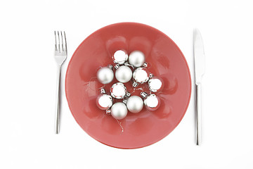 Image showing red plate with Christmas silver ball