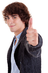 Image showing young man smiling, with thumb up