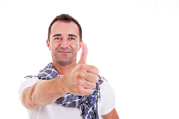 Image showing handsome man with thumb raised as a sign of success, 