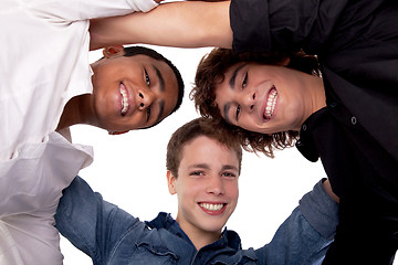 Image showing three young man of different colors,looking to camera and smiling