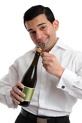 Image showing Man or bartender opening wine champagne