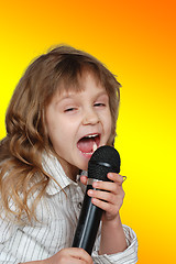 Image showing singing kid with a microphone