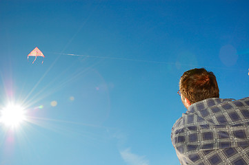 Image showing man flying a kite