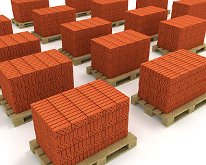 Image showing Lot of stacks of orange bricks with pallets isolated