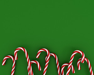 Image showing Christmas candies on green background