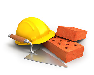 Image showing Bricks, trowel and a yellow plastic helmet 