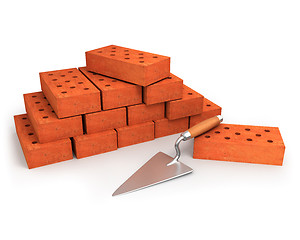 Image showing Trowel and stack of bricks isolated on white 