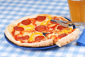 Image showing Hot spicy pizza and beer