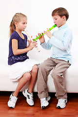 Image showing Kids playing flute