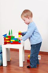 Image showing Lovely boy playing with blocks