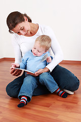 Image showing Reading with mom