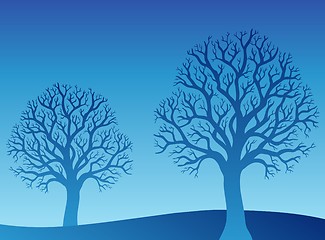 Image showing Two blue trees