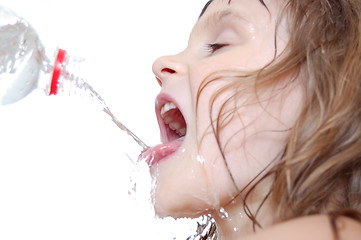 Image showing thirsty child drinking water