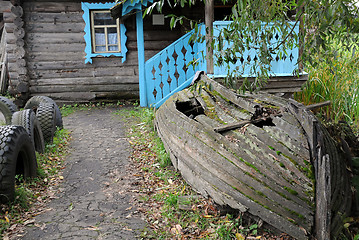 Image showing Old Shabby Boat and the House