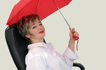 Image showing Businesswoman with a red umbrella