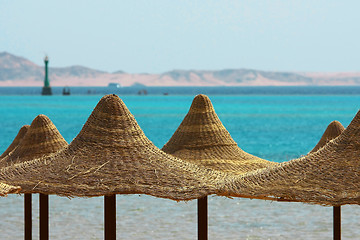 Image showing Umbrellas, Mount and Red Sea