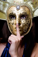 Image showing Young woman in a Venetian mask